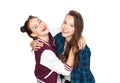 Happy smiling pretty teenage girls hugging Royalty Free Stock Photo