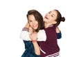 Happy smiling pretty teenage girls hugging Royalty Free Stock Photo