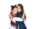 Happy smiling pretty teenage girls hugging Royalty Free Stock Photo