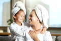 Happy, smiling and relaxed mother and daughter spa day at home with face masks for healthy skincare and personal hygiene Royalty Free Stock Photo