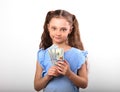 Happy smiling rich kid girl holding money on white background wi Royalty Free Stock Photo