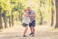 Portrait of a beautiful happy senior couple in love dancing in the park Royalty Free Stock Photo