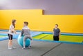 Happy smiling small kids jumping on indoors trampoline in entertainment center Royalty Free Stock Photo