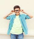 Happy smiling smart teenager boy in glasses wearing a checkered shirt Royalty Free Stock Photo