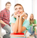 Happy smiling student girl with books at school Royalty Free Stock Photo