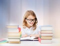 Happy smiling student girl reading book