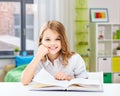 happy smiling student girl reading book at home Royalty Free Stock Photo