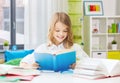 happy smiling student girl reading book at home Royalty Free Stock Photo
