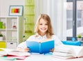 happy smiling student girl reading book at home Royalty Free Stock Photo