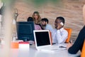 Happy smiling successful African American businessman in in a modern bright startup office indoors Royalty Free Stock Photo