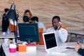 Happy smiling successful African American businessman in in a modern bright startup office indoors Royalty Free Stock Photo