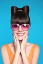 Happy smiling teen girl with bow hairstyle, funny model wearing Royalty Free Stock Photo