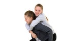 Happy Smiling Teen Girl Piggy Backing her Twin Sister