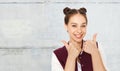 Happy smiling teenage girl showing thumbs up Royalty Free Stock Photo