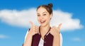 Happy smiling teenage girl showing thumbs up Royalty Free Stock Photo