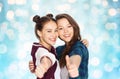 Happy smiling teenage girls showing thumbs up Royalty Free Stock Photo