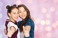 Happy smiling teenage girls showing thumbs up Royalty Free Stock Photo