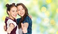 Happy smiling teenage girls showing thumbs up Royalty Free Stock Photo