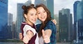 Happy smiling teenage girls showing thumbs up Royalty Free Stock Photo