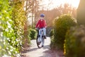 Happy smiling teenager boy riding his bike on sunset Royalty Free Stock Photo