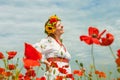 Happy smiling ukrainian woman among blossom field Royalty Free Stock Photo