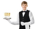 Happy smiling waiter serving champagne on a tray Royalty Free Stock Photo