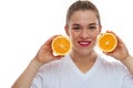 Happy smiling woman holding two pieces of oranges Royalty Free Stock Photo