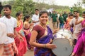 Happy smiling Woman drummer plays drum in a rally