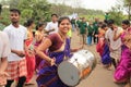 Happy smiling Woman drummer plays drum in a rally