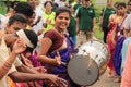 Happy smiling Woman drummer plays drum in a rally