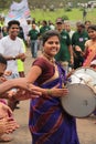 Happy smiling Woman drummer plays drum in a rally