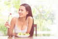 Happy smiling woman eating tomato and salad for healthy body and healthy food concept Royalty Free Stock Photo