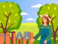 Happy smiling woman gardener wearing uniform and hat near garden at background with garden tools Royalty Free Stock Photo