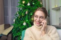 Happy smiling woman in glasses talking via mobile phone Royalty Free Stock Photo