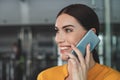 Happy smiling woman having conversation by phone