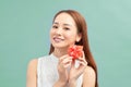 Happy smiling woman holding small red gift box Royalty Free Stock Photo