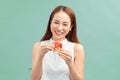 Happy smiling woman holding small red gift box Royalty Free Stock Photo