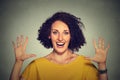 Happy, smiling woman making five times sign gesture with hands fingers