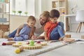 Happy smiling woman mother and children drawing together with pencils at home Royalty Free Stock Photo