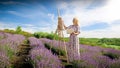 Happy smiling woman painting lavender field at morning
