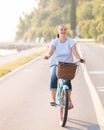 Happy smiling woman riding bicycle Royalty Free Stock Photo