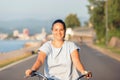 Happy smiling woman riding bicycle Royalty Free Stock Photo