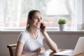 Happy smiling woman talking over phone in morning at home Royalty Free Stock Photo
