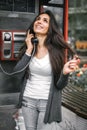 Happy and smiling woman talking in the retro phone booth Royalty Free Stock Photo