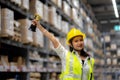 Happy smiling woman warehouse Staff holding a trophy after being selected as an outstanding employee