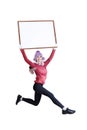 Happy smiling woman in winter clothing holding blank board - isolated Royalty Free Stock Photo