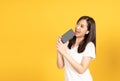 Happy smiling young asian woman wearing earphones listening to music Royalty Free Stock Photo