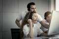 Happy smiling young beautiful woman with headphones working at call center service desk consultant with her teammates while team s Royalty Free Stock Photo