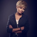 Happy smiling young blond woman with short bob hair style and tr Royalty Free Stock Photo