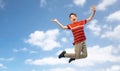 happy smiling young boy jumping over sky Royalty Free Stock Photo